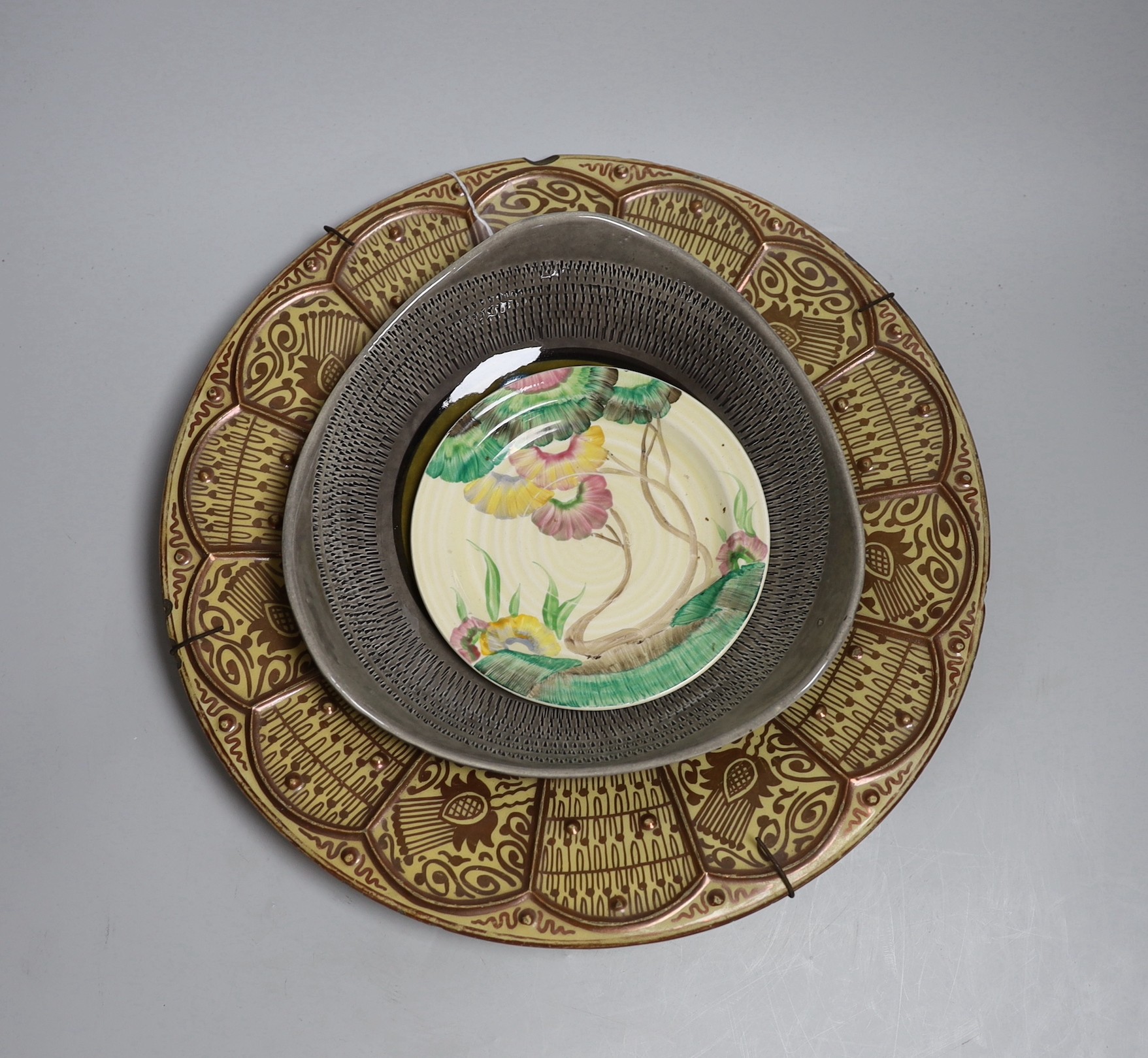 A Spanish Hispano-Moresque lustre charger, a Clarice Cliff Bizarre plate and a German bowl, largest 35cm